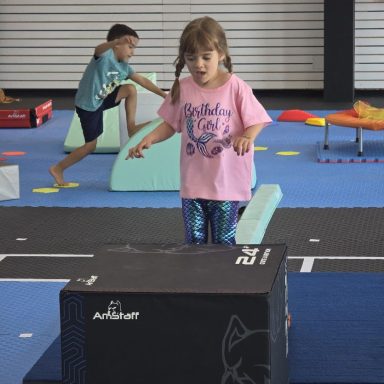 Kids Gymnastics Foam Obstacle Course in Rockland Child climbing a foam block on the obstacle course at The RAZ gym