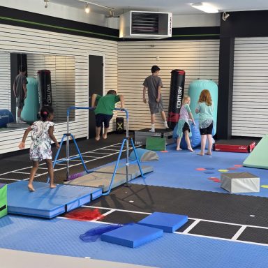 Kids Gymnastics Uneven Bars Training in Rockland Kids gymnastics class using the training bars and obstacle course at The RAZ