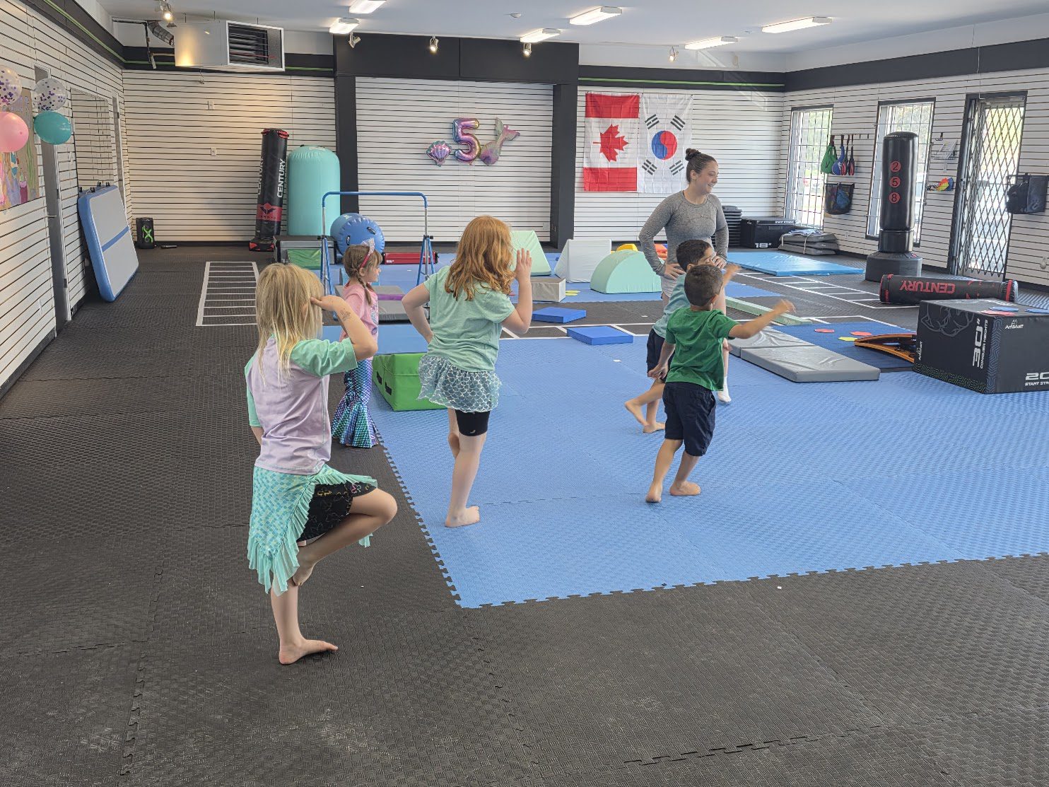 Kids tumbling class in action on the blue floor at The RAZ in Rockland